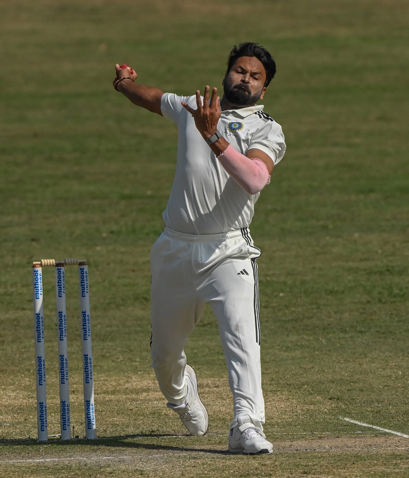 Mukesh Kumar runs in to bowl