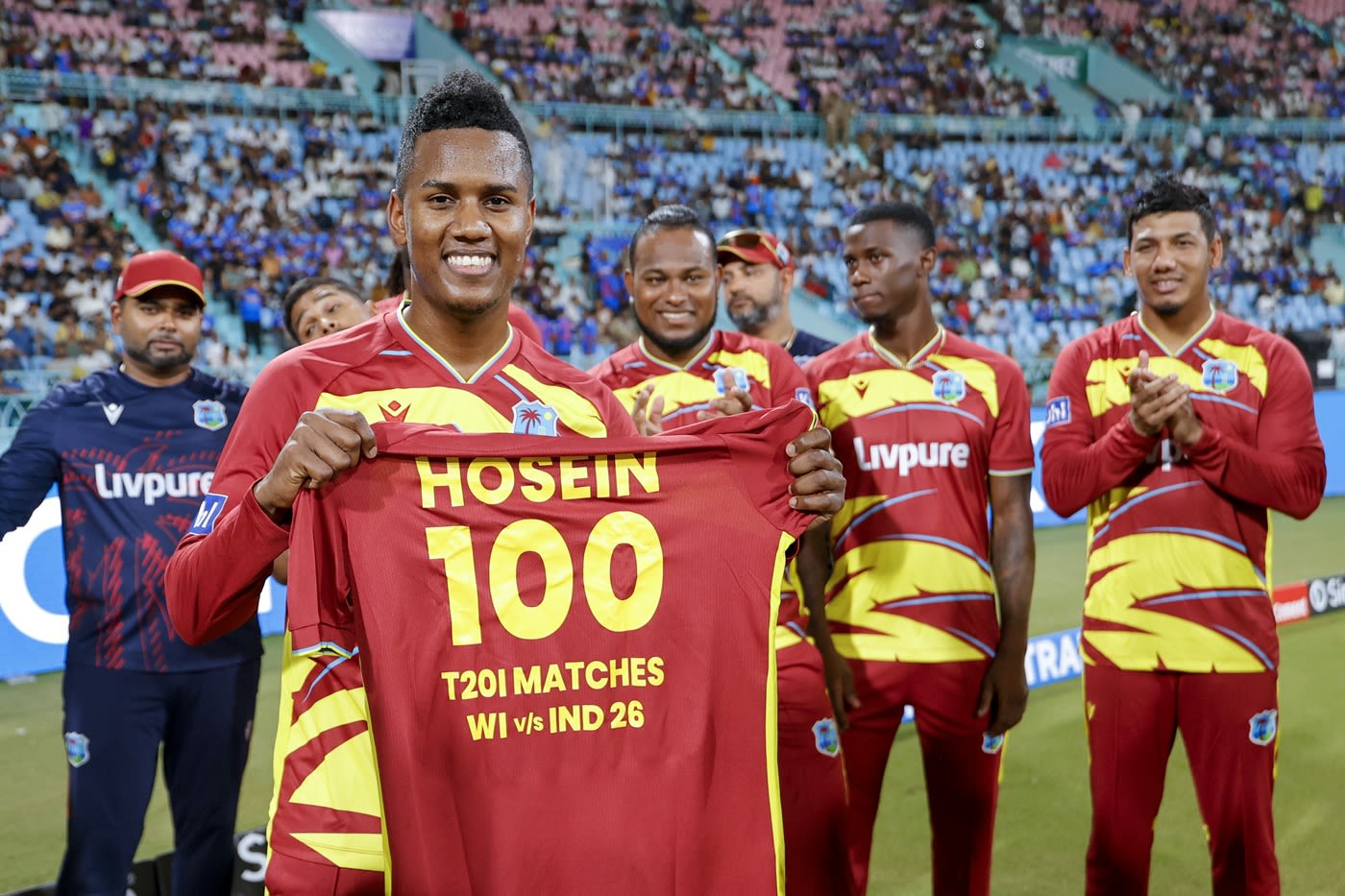 Akeal Hosein presented with a special jersey for his 100th T20I