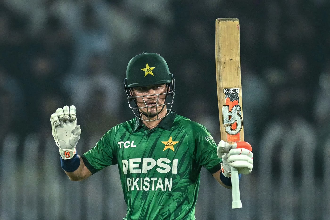 Maaz Sadaqat celebrates his maiden T20I fifty