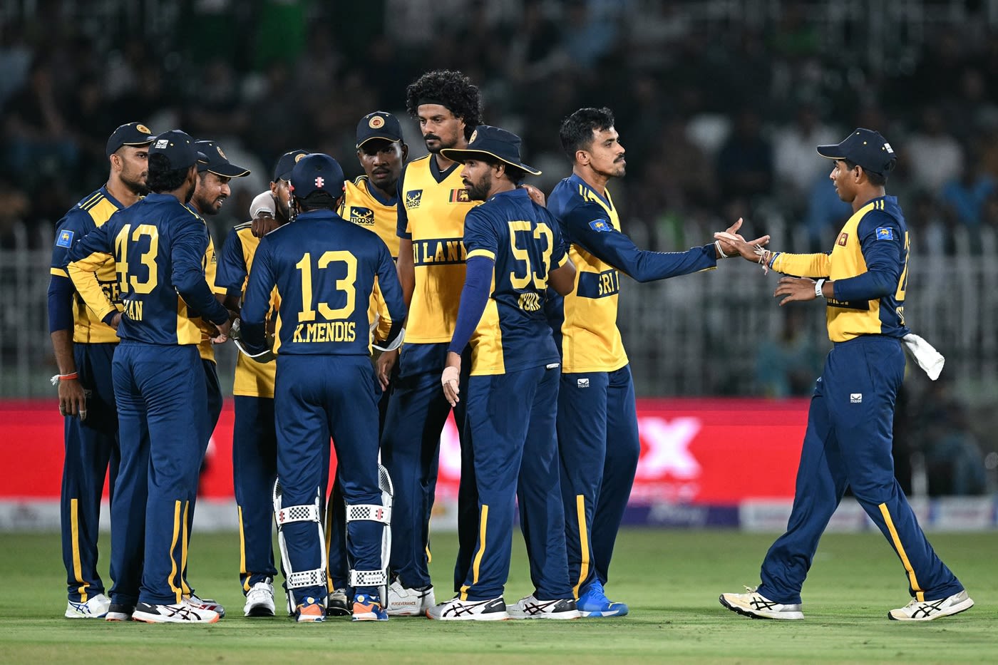 The Sri Lankan players celebrate a wicket