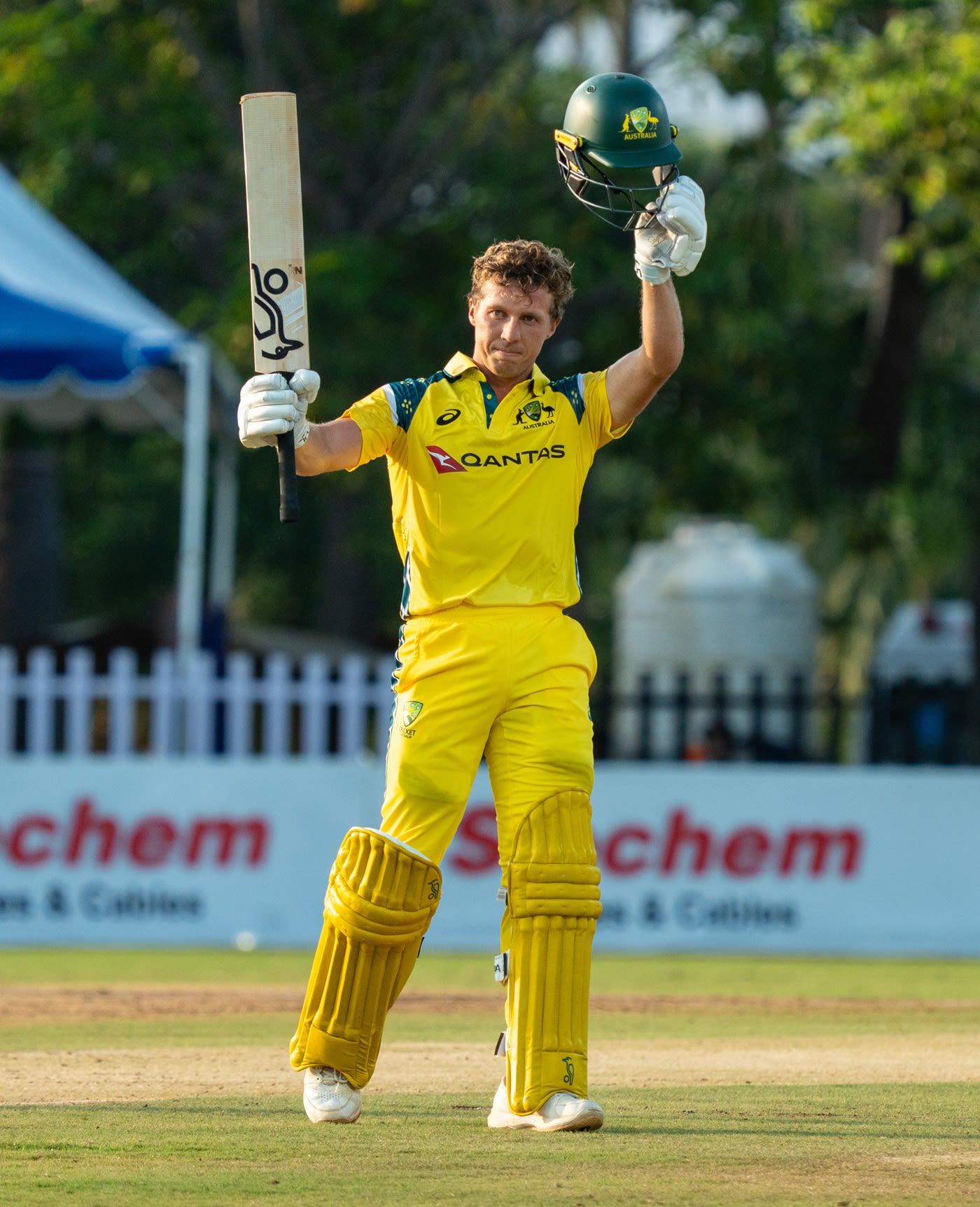 Nathan McSweeney raises his bat after getting to a century