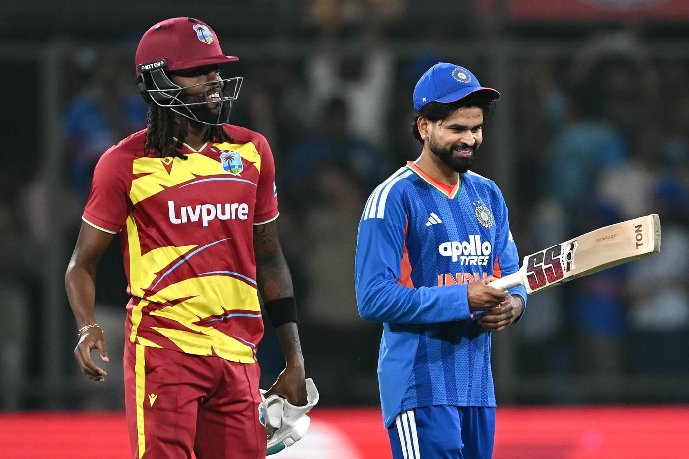 Shreyas Iyer looks at Shamar Springer's bat after he smashed an unbeaten 11-ball 35