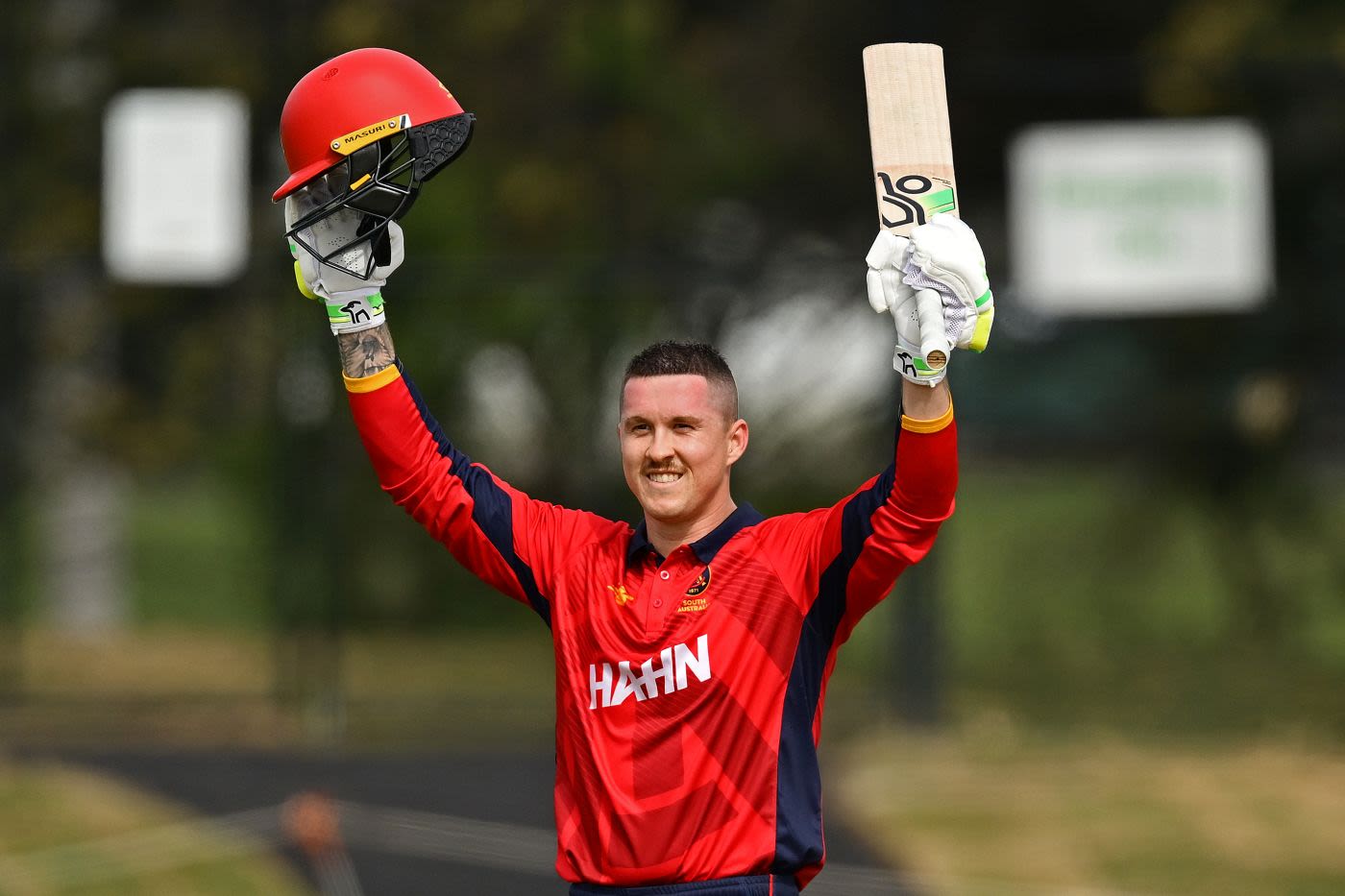 Matthew Gilkes celebrates his century