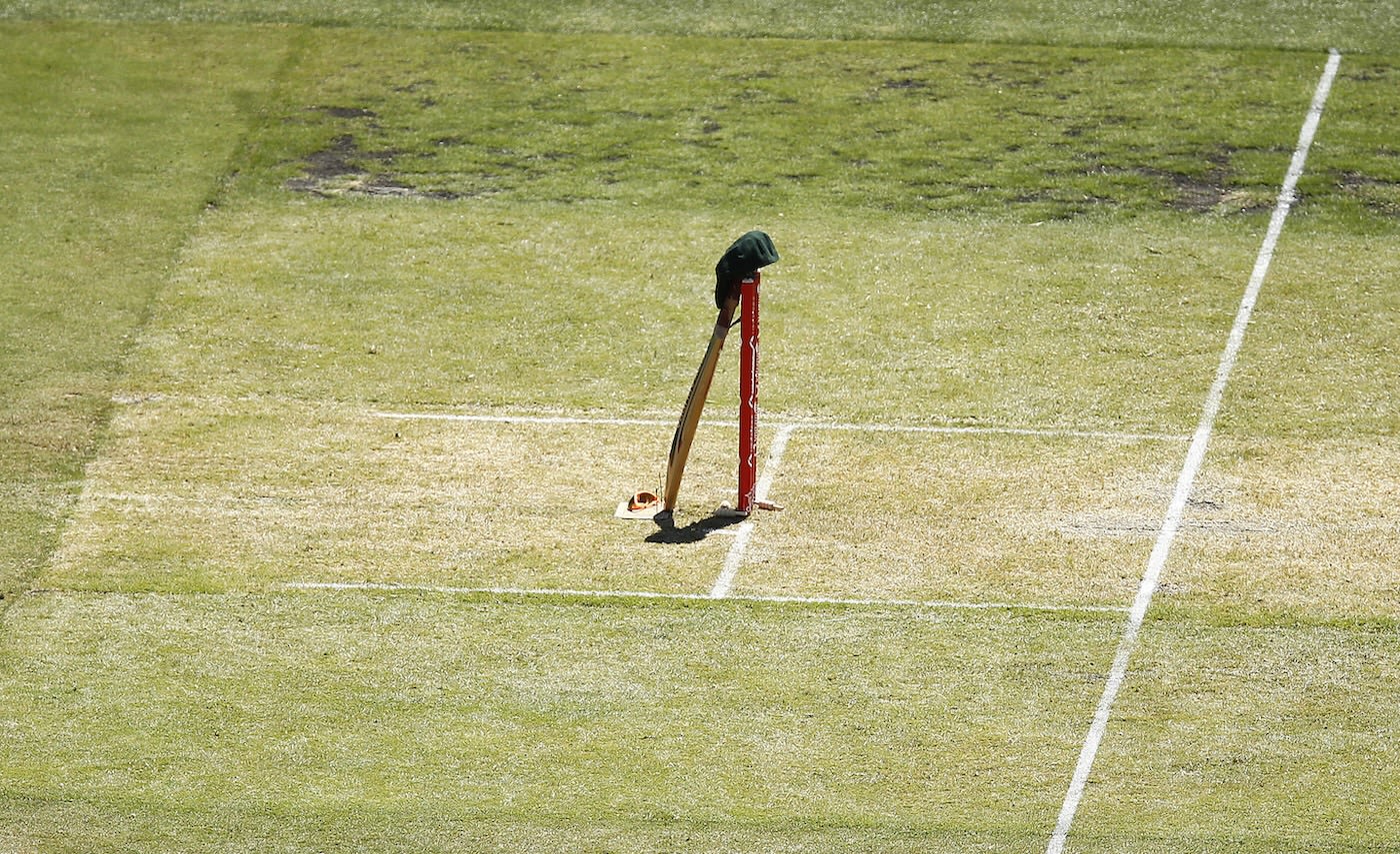 The last bat, sunglasses and baggy green used by Dean Jones placed at the stumps as a tribute