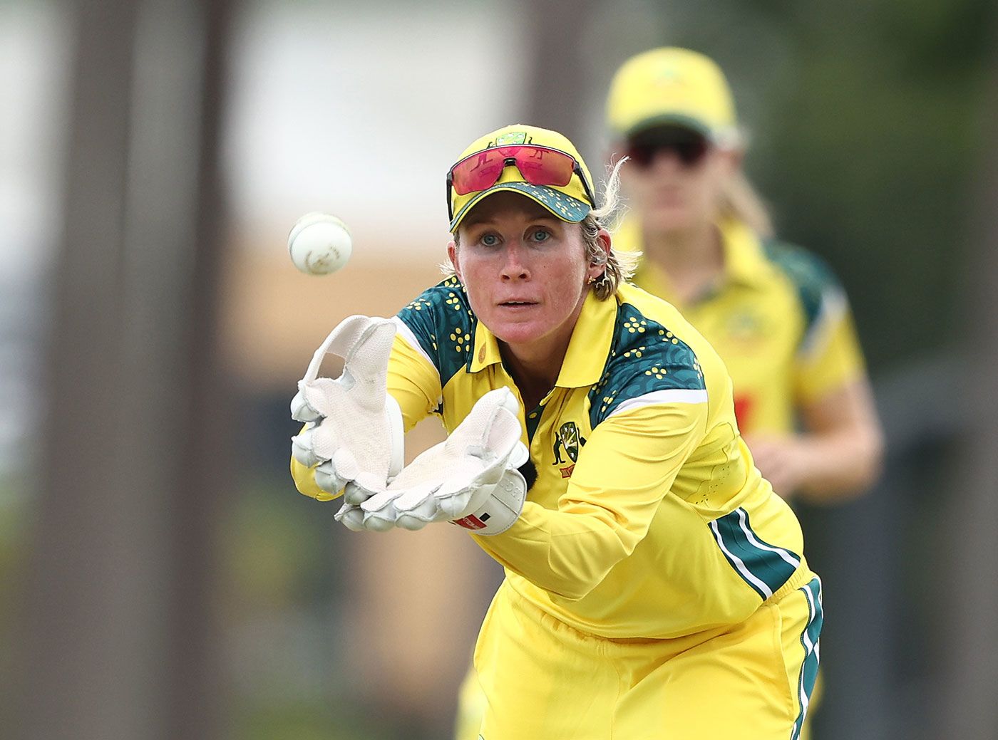 Beth Mooney gathers the ball