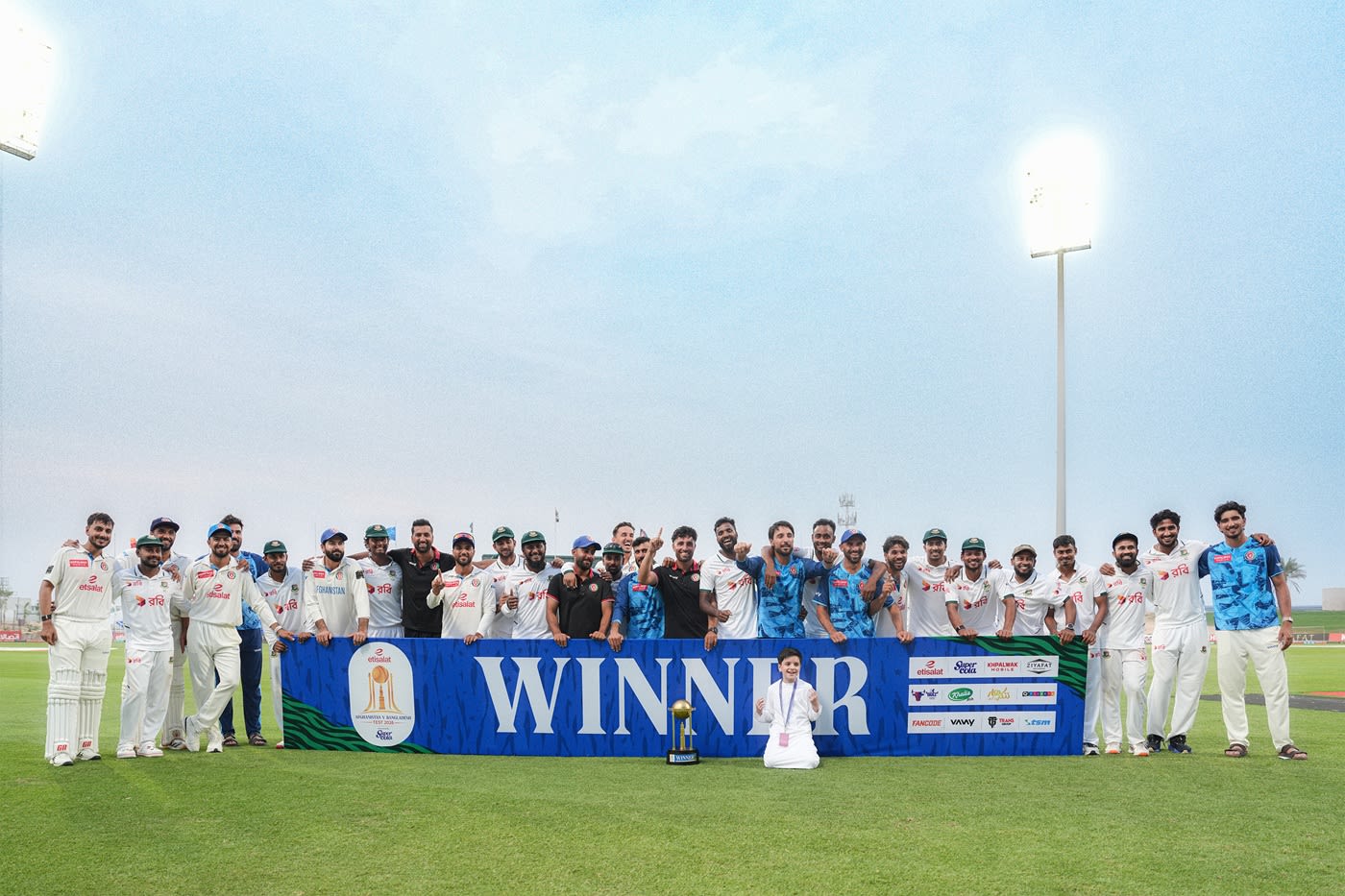 Players pose after drawing the one-off Test