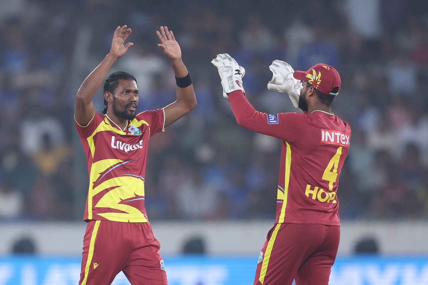 Keemo Paul celebrates a wicket with Shai Hope
