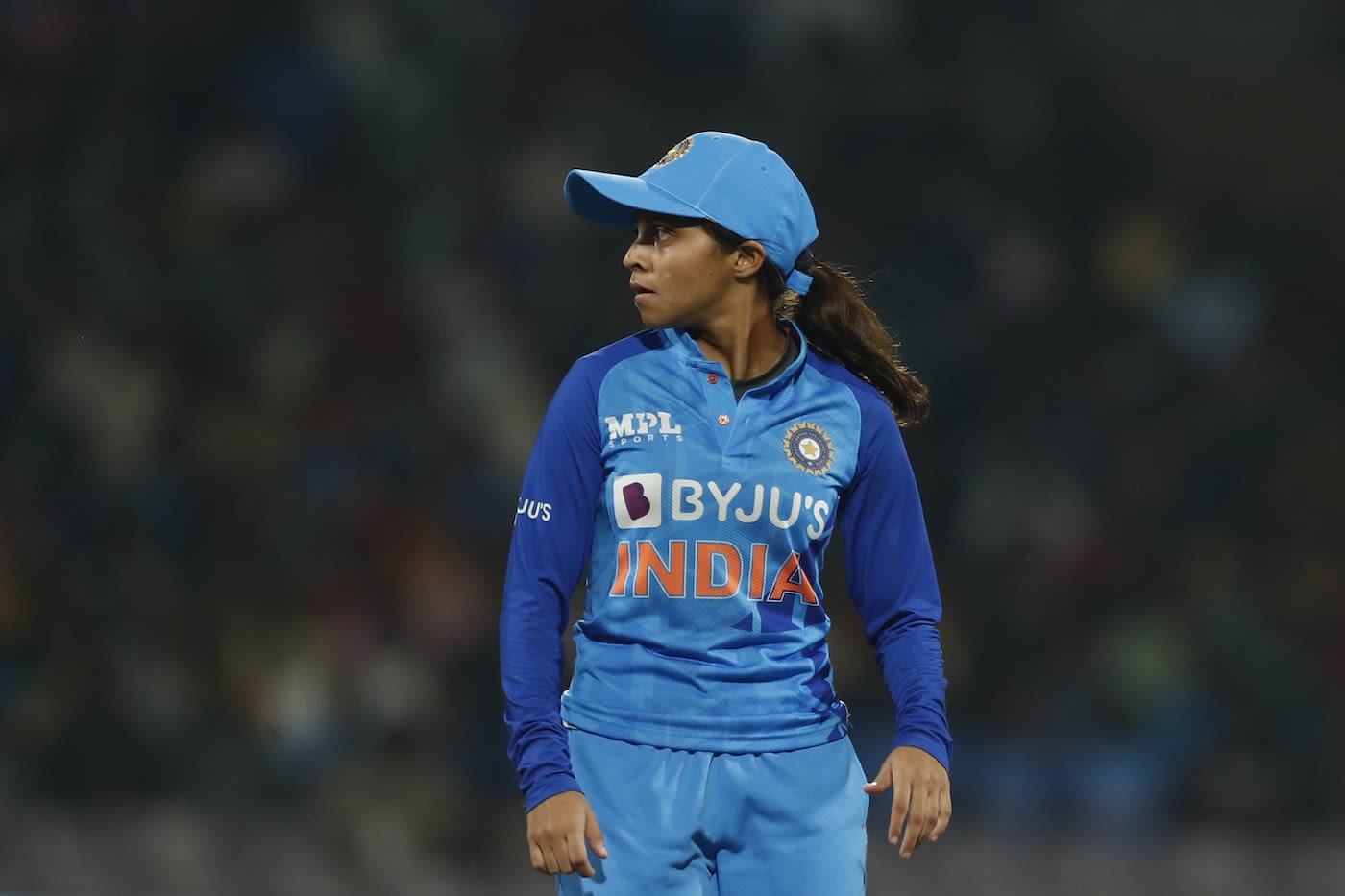Devika Vaidya looks on in the field