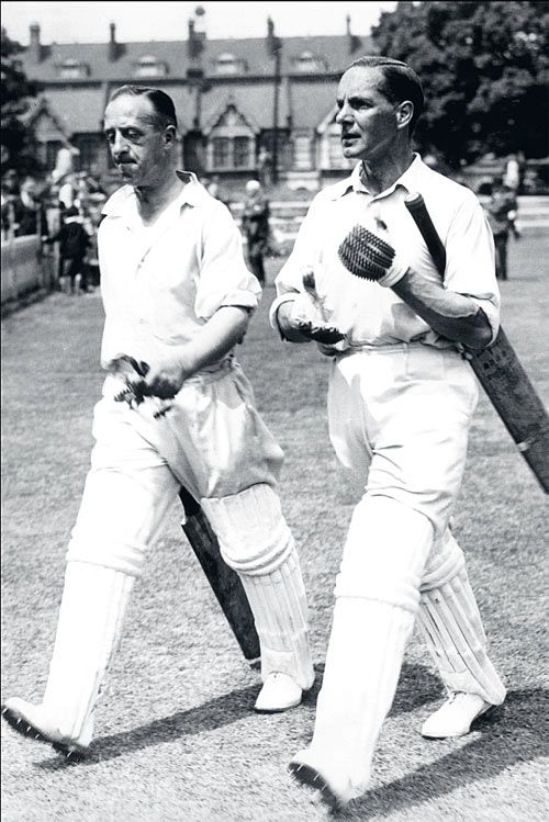 Percy Holmes and Herbert Sutcliffe return to the pavilion after their 555 first-wicket stand