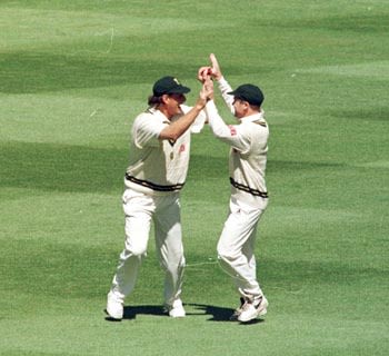 Brian McMillan and Daryll Cullinan high five