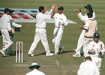 Graham Thorpe departs as Iqbal Siddiqui celebrates with team-mates