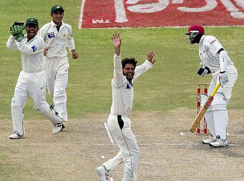 Courtney Browne is caught behind by Kamran Akmal off Shahid Afridi