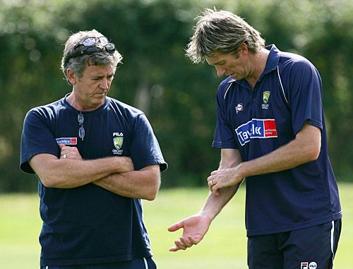 Glenn McGrath shows Errol Alcott his sore elbow