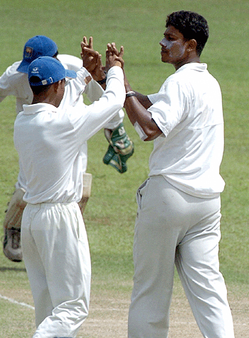 Tharanga Lakshitha celebrates the wicket of Javed Omar