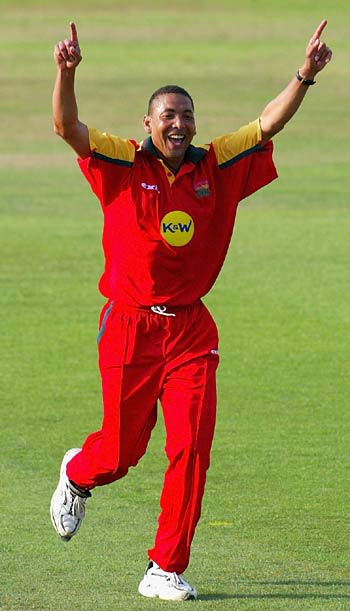 Phil Defreitas celebrates dismissing Adam Hollioake
