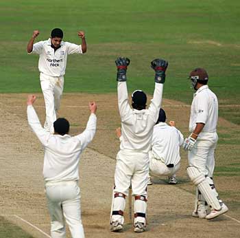 Yogi Golwolkar takes the wicket of Scott Newman