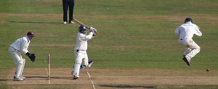 David Fulton takes evasive action as Mushtaq Ahmed drives