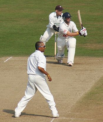 Min Patel looks on as Matt Prior holes out