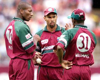 West Indies skipper Adams in discussion with bowlers McLean and Williams