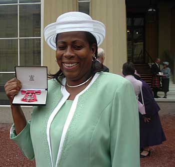 Nadine George receives her MBE at Buckingham palace
