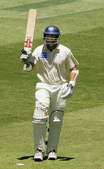 Matthew Phelps celebrates after reaching his half-century in the Pura Cup game against Tasmania