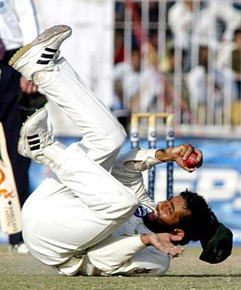 Asim Kamal takes an excellent diving catch to dismiss Kevin Pietersen