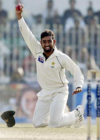 Asim Kamal celebrates his excellent diving catch to dismiss Kevin Pietersen