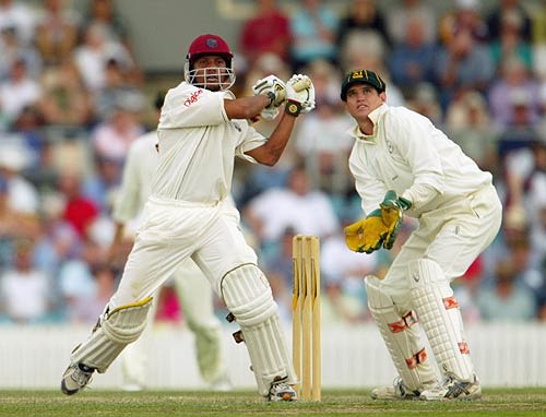 Ramnaresh Sarwan swings to leg as Adam Crosthwaite follows the ball