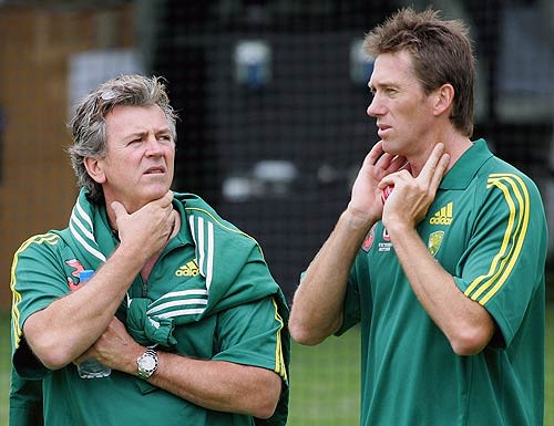Glenn McGrath chats with physio Errol Alcott during training at the WACA
