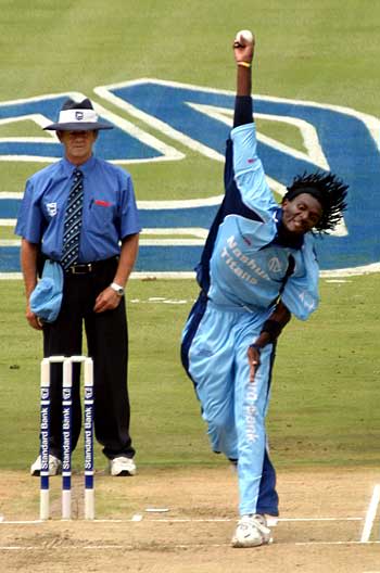 Ethy Mbhalati lets the ball, and his hair, fly