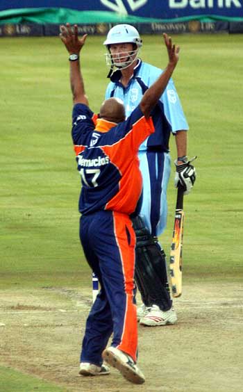 Gerald Dros is trapped lbw by Roger Telemachus