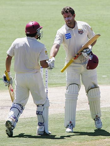 Brendan Nash congratulates Martin Love on his century 