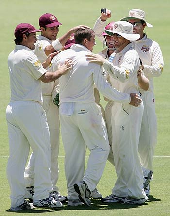 Daniel Doran is congratulated after taking the wicket of Clint Heron