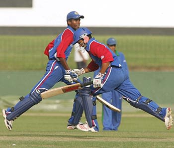 Mrunal Patel (left) and Nisarg Patel (right) complete another run during the USAs successful run-chase against Namibia