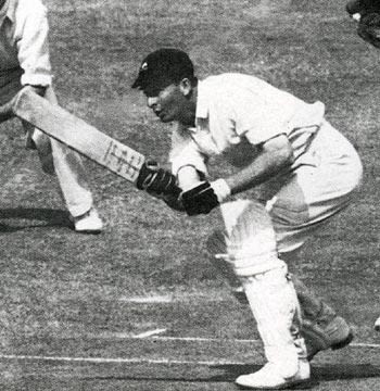 Bruce Mitchell pushes a single to reach his hundred