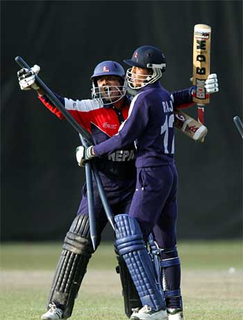 Ratan Rauniyar and Raj Shrestha embrace after Nepal's one-wicket win over New Zealand in the Plate final