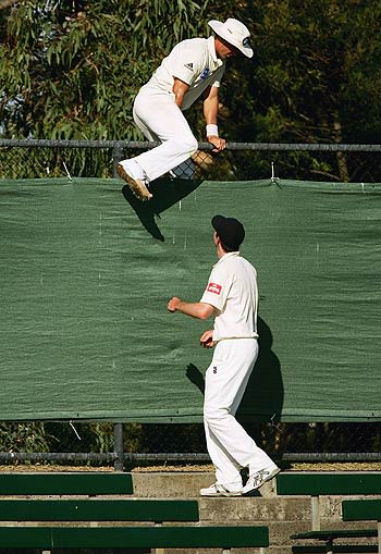 'Can I have the ball back please?' - Gerard Denton of the Bushrangers jumps the fence to retrieve the ball