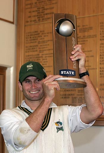 Jarrod Englefield holds the State Championship trophy aloft after Central Districts' triumph