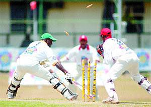 Rawl Lewis is deftly stumped by Denesh Ramdin to end his brief cameo of 16