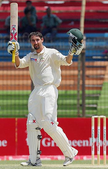 Jason Gillespie acknowledges the cheers on reaching his 150