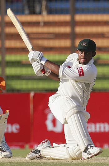 Shahriar Nafees sweeps the spinners during his unbeaten 75