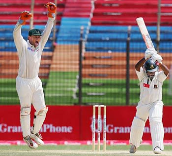 Adam Gilchrist celebrates catching Aftab Ahmed