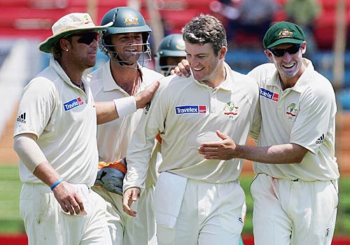 Stuart MacGill is congratulated on removing Abdur Razzak