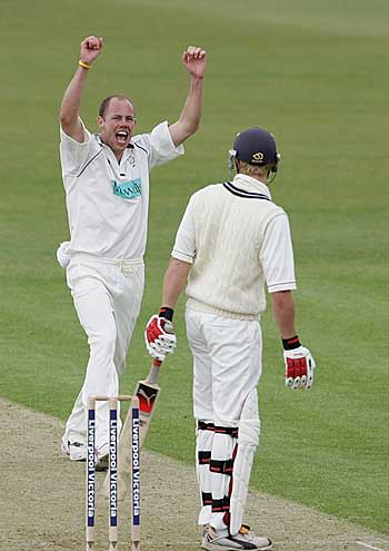 Billy Taylor celebrates the wicket of Nick Compton