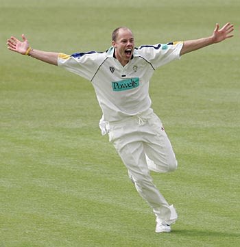 Billy Taylor roars his delight after grabbing a hat-trick to rout Middlesex for 98