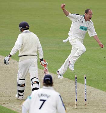And another. Billy Taylor can't believe his luck as he grabs Paul Weekes' wicket