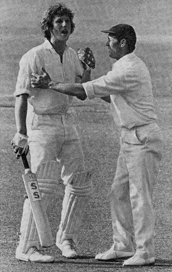 Ian Botham is helped by Peter Sainsbury after being hit by Andy Roberts