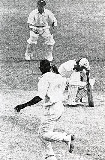 Nari Contractor clutches his head after being struck by Charlie Griffith