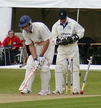 Chris Adams is bowled by Ben Hutton