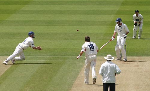 Iain Sutcliffe dives but just fails to catch Chris Peploe